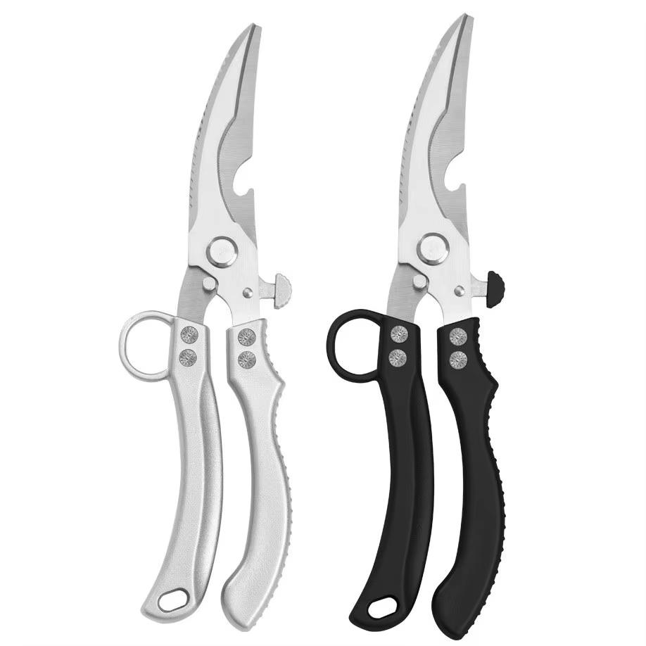 Stainless steel kitchen scissors cutting chicken bones
