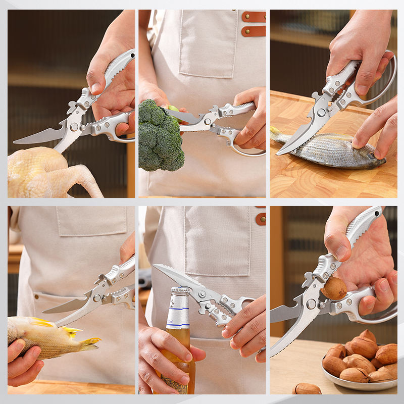 Kitchen scissors cutting chicken meat