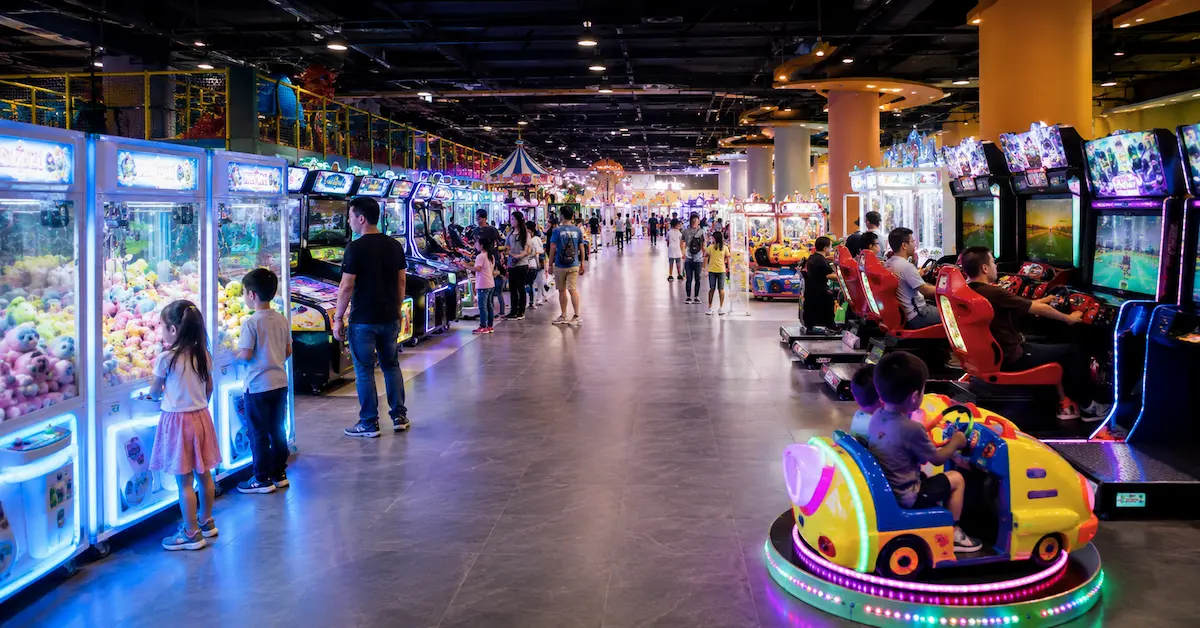 Arcade equipment in busy indoor game center